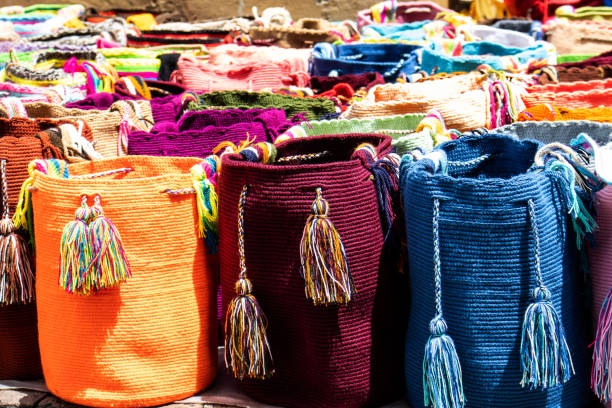 Street selling in Bogota of traditional bags hand knitted by women of the Wayuu community in Colombia called mochilas