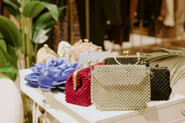 Multicolored Purses on White Table